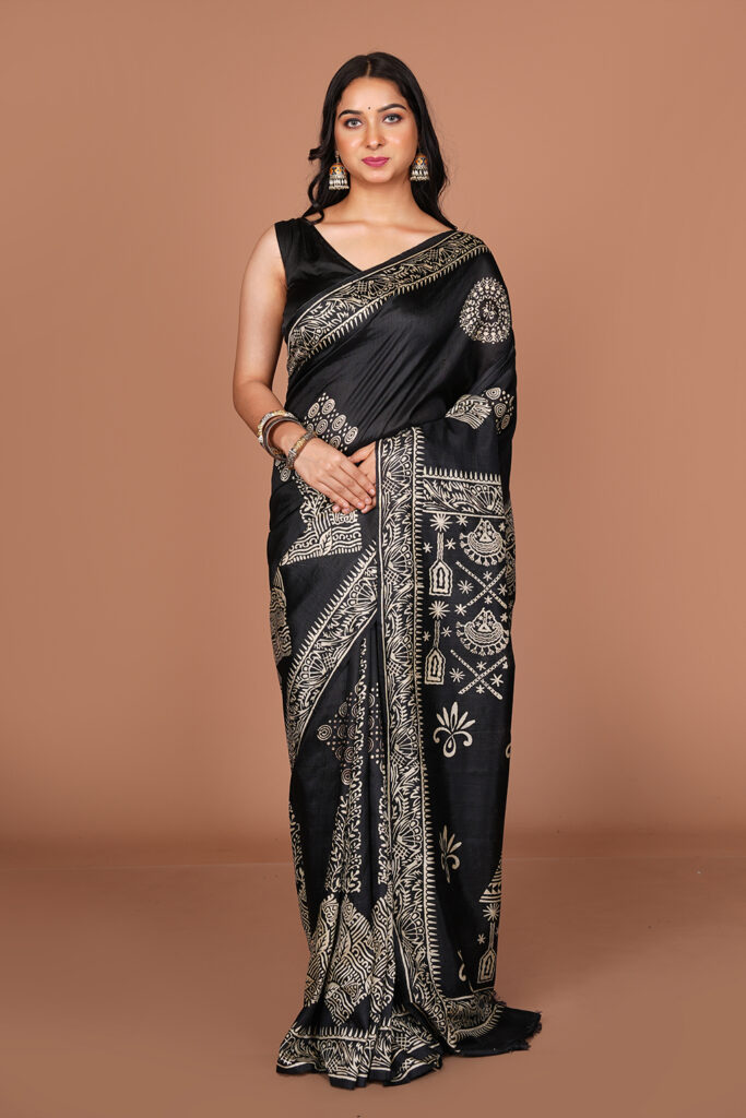 Printed / Block Printed Saree (featuring intricate traditional motifs along the borders and body)